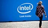 Someone walking by a sign saying Intel Look Inside