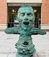 Belfast, northern Ireland - A bronze statue named `Eco' standing outside the McClay Library