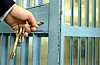 Generic pic of someone locking up a prison door
