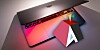 The Asahi Linux logo next to an Apple Silicon MacBook