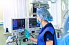 Someone using some hospital equipment to treat a patient