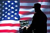 Generic shot of US military person in front of the US flag