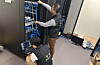 Two police officers inspect servers as part of Operation Secure's investigations into infostealer malware in Asia