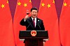 President Xi holding up a glass as a toast at the end of some speech
