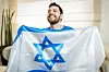 Happy man holds flag of Israel. Pic: Shutterstock