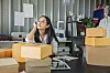 young startup exec boxes up things