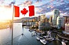 Canadian flag flying over downtown Vancouver, British Columbia, Canada