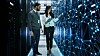Two IT people working in a data center