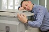 man hugs printer