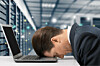 stressed exec in server room. pic shutterstock