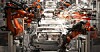 Cars being assembled in a factory
