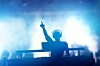 DJ at mixing deck. Photo by Shutterstock