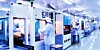 People using equipment Inside a silicon chip factory