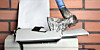 A printer being smashed with an ax