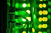 Close up of datacenter equipment illuminated by lots of green light
