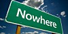 Nowhere road sign backed by clouds