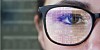 numbers reflected in staffer's glasses