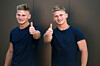twin men give the thumbs up