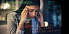Someone looking stressed out over cybersecurity