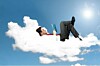 man relaxes on cloud