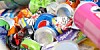 Pile of empty drink cans and junk food wrapping
