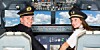 Airline pilots in cockpit strangely wearing hats