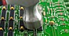 A circuit board with chips hit with a hammer