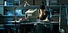 Young nerd / geek at a terminal in a computer room