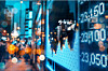 City scene with financial data in view