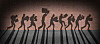 Illustration of silhouettes of people running past a building carrying stolen items