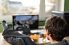 man watches video on his desktop