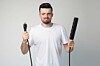 Man holding plug socket