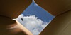 Clouds seen outside a cardboard box