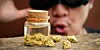 Thief looking at gold nuggets