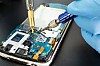 Technician repairs phone