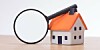 House and magnifying glass