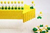 Lego business lemmings walking off an arrow-shaped cliff