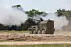 RCH 155 mobile artillery module mounted on a Boxer armored vehicle chassis, opens fire at a military  training area in Germany.
