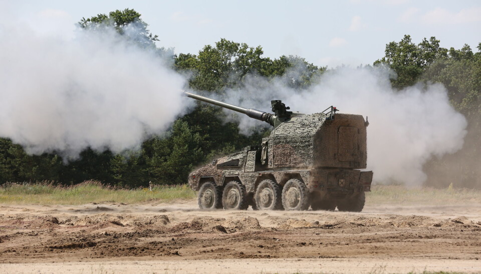 RCH 155 mobile artillery module mounted on a Boxer armored vehicle chassis, opens fire at a military training area in Germany.