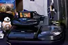 Sega 32X add-on on a Sega Genesis console beside other retro gaming hardware.