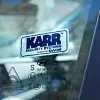 A KARR security system sticker in a vehicle window