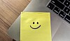 IT department put sticky notes on the laptops to help employees log in
