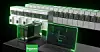A row of electrical cabinets with a laptop computer in front represents Schneider Electric's software-defined medium voltage switchgear platform for datacenters