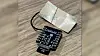 Image shows the second small, black recording device recovered as part of the investigation into the OpenAI case.