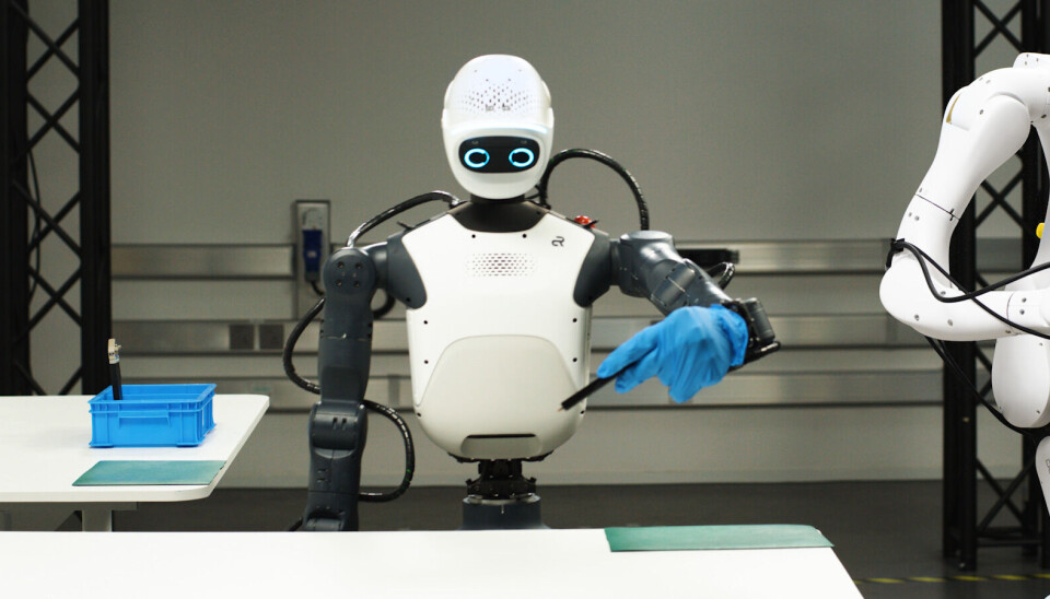 A robotic humanoid torso performs tasks
